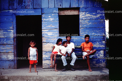 Children sitting at home, house, building, Nicaragua