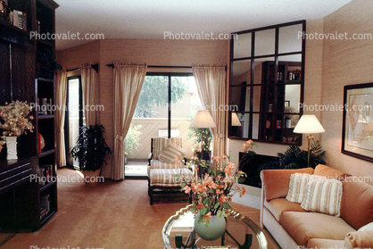 Sofa, Lamps, Curtains, Mirror, flower arrangements, pillows, fireplace