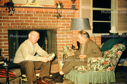 Men, Chair, sitting, fireplace, 1940s