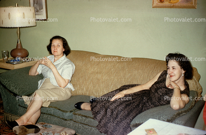 Women on a Sofa, smiles, 1940s
