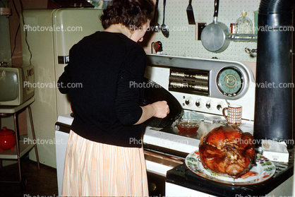 Stove, Turkey, making dinner, woman, clock, December 1962, 1960s