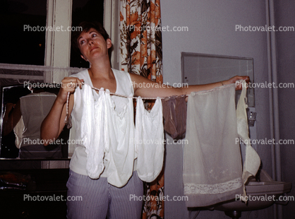 Girl Laundering her lingerie, hanging to dry, Drying Rack