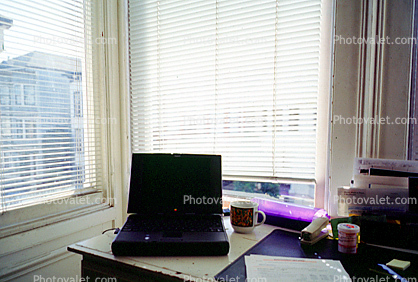 Laptop Computer, desk, cup, mug, stapler