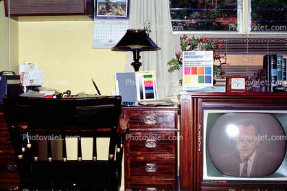 Television Screen, lamp, color chart, lampshade, desk, clock, drawers, books, 1960s
