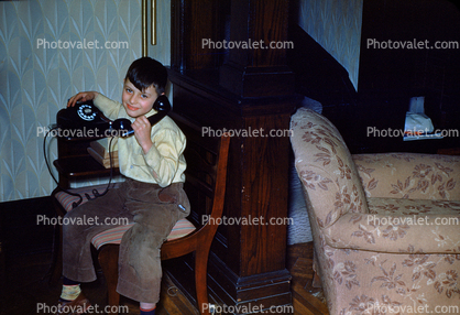 Boy on a phone, sitting, smile, pants, shirt, 1940s