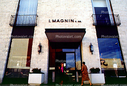 Women at an I. Magnin & Co., signage, door, entrance, 1980s