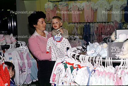 baby clothes, Shopping Mall, shoppers, window display, woman, boy, child, 1980s