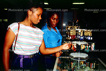 Women, Key Chain, Shopping Mall, interior, inside, indoors, shoppers, clothing store, woman, racks, 1980s
