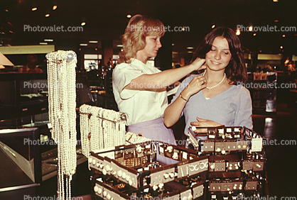 Two Women Shopping, Ear Rings, interior, inside, indoors, shoppers, jewelry, necklace, smiles, racks, 1980s