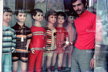 Man selling boys clothes, Iran, April 1972, 1970s