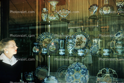 Dishes, glass, window display, woman, Portugal, 1950s