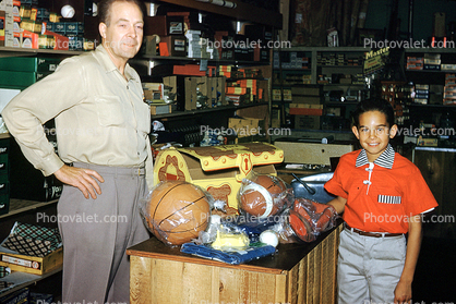 Sports store, Boy, clerk, Mr. Wheeler, Arcadia Sporting Goods, December 16, 1958, 1950s
