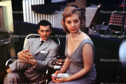 Sultry Woman, Suited Man, Sitting, 1950s