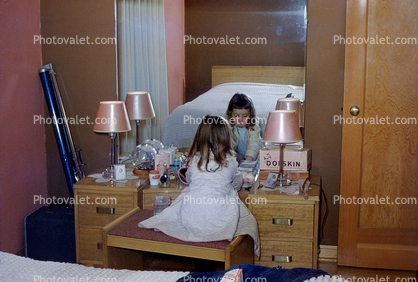 Little girl at moms vanity, mirror, playing with make-up, Pink Lampshades, 1950s