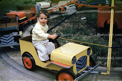 Jeep, girl, smiles, kiddie ride, 1950s