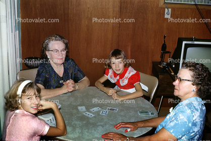 Family playing cards, card table, girls, women, grandma, 1950s