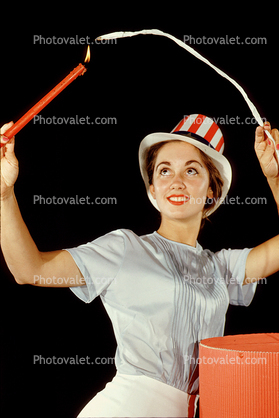 Woman, Candle, hat, breasts, arms, face, smiles, burn, 1950s