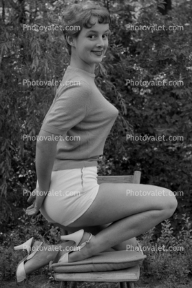 Cute Lady in a Bullet Bra, shorts, high heels, 1950s