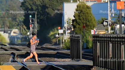 Caltrain Railroad Tracks, San Bruno, California, women running