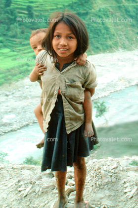 Sister carries her bother, Nepal, Araniko Highway