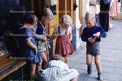 Boys, Girls, playing a game on the sidewalk, Groninger, Netherlands, September 1959, 1950s