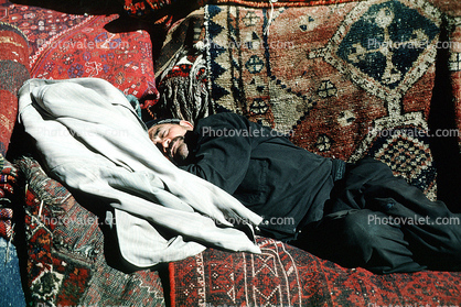 Rug merchant's nap, Shiraz, Iran