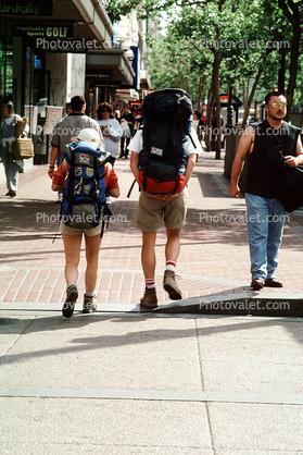 Couple walking with back pack