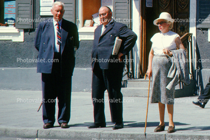 Men, Women, cane, curb, sidewalk, dress, suit and tie, 1960s