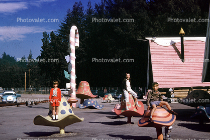 Mushrooms, candaycane, cars, Santas Village, California, 1960s