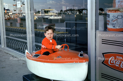 Boy on a Kiddie Boat Ride at the Supermarket, 1950s