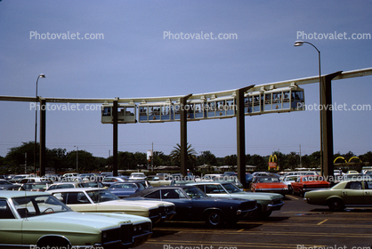 Parking Lot, Monorail Trains, hanging passenger cars, Tampa Florida, 1960s