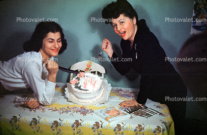 Women, Funny, Stabbing a Cake, Table, flowers, floral, 1950s