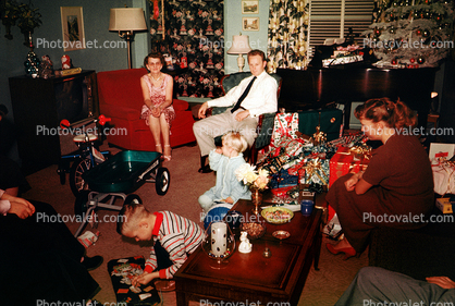 Christmas Tree decorated, boy, girl, father, mother, pony tail, tricycle, piano, presents, 1950s