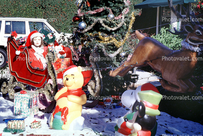 sled, MsSaint Santa Claus, bear, tree, presents, storybook scene Oxnard
