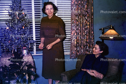 woman, smiles, tinsel tree, Presents, Decorations, Ornaments, Tree, Christmas Tree decorated, 1940s