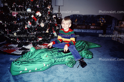 boy, tree, blow-up alligator, Christmas Morning, 1960s