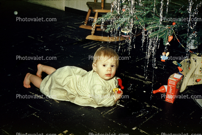 Baby under a Christmas Tree, toddler, 1950s