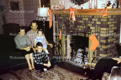 woman, man, girl, boy, daughter, son, stockings, mantle, ribbons, lamp, Fireplace, Family, 1940s