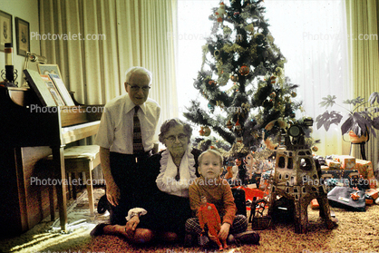 Christmas morning, grandfather, grandmother, grandson, piano, woman, man, boy, Tree, Presents, Gifts, Decorations, Ornaments, 1950s