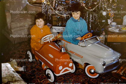 Girls in their new Pedal Cars, toys, 1950s
