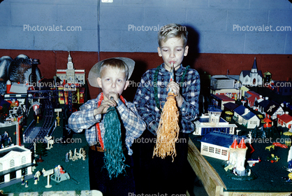 Boys, toy trainset, toot horns, 1950s