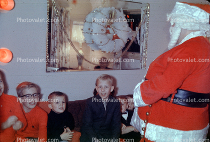 Santa Claus with a bunch of boys, mirror, wreath, 1950s