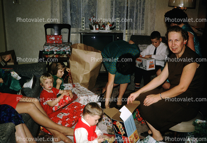 Opening Christmas Gifts, presents, boys, girls, woman