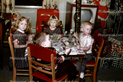 Children at the kids table, boy, girls, television, 1950s