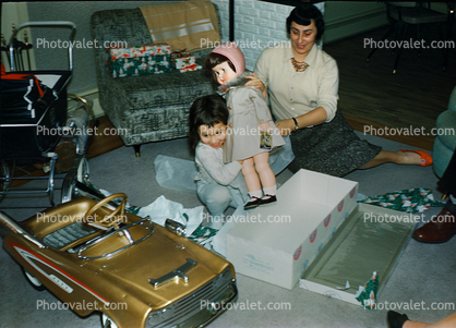 Girl with her new doll, Mom, Daughter, presents, Golden Pedal Car, toy, 1950s
