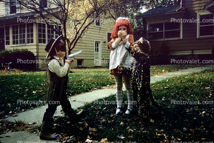 Raggedy Ann under arrest, sheriff, gun, mask, cowboy hat, October 1973, 1970s