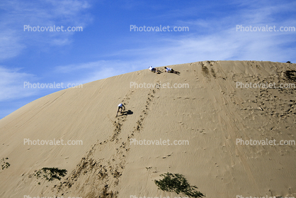 Climbing a huge sand dune, footsteps, footprints