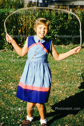 Girl, Jump Rope, Backyard, dress, smiles, smiling, September 1953, 1950s