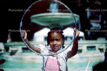 Girl Playing with Bubbles