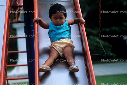 Toddler Sliding on a Slide